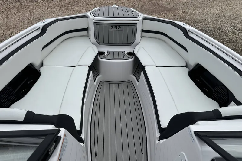 Slide: The Image of 2025 Yamaha Boats 252SD interior with white seating and sleek design. - 20