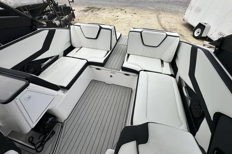 Slide: The Image of 2025 Yamaha Boats 252SD interior with sleek white and black seating, modern design. - 10