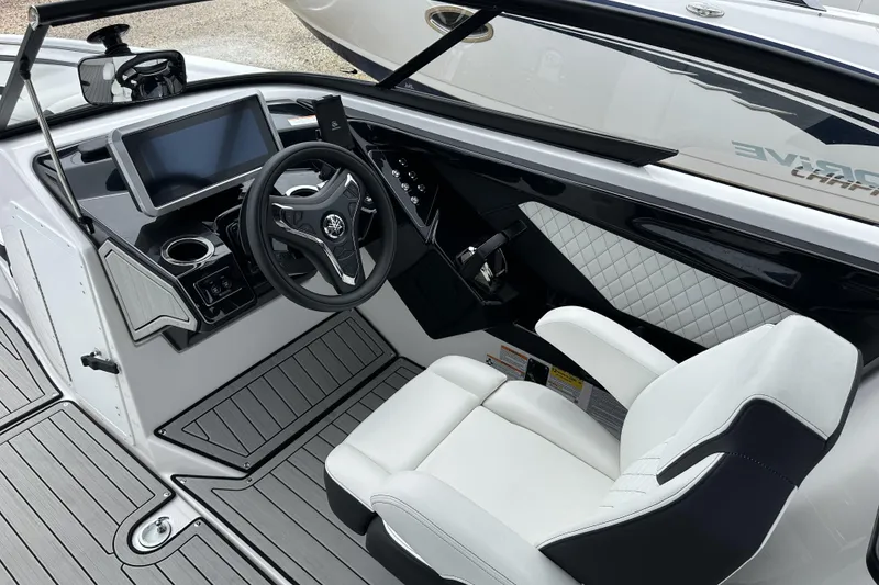 Slide: The Image of 2025 Yamaha Boats 252SD cockpit with modern steering wheel and touchscreen display. - 21