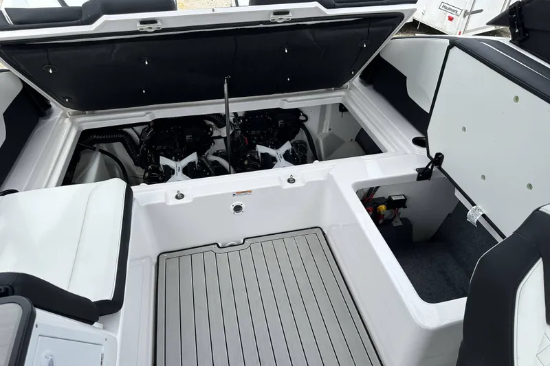 Slide: The Image of 2025 Yamaha Boats 252SD engine compartment with open hatch, showcasing dual engines. - 23