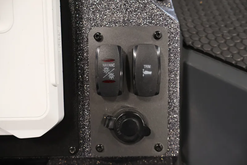 Slide: The Image of Control panel of 2023 Ranger RT188P boat with navigation and trim switches. - 16