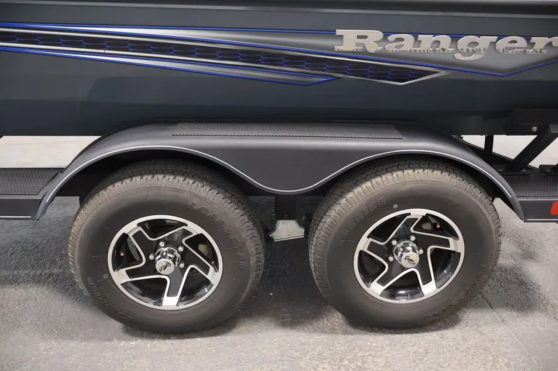Slide: The Image of 2023 Ranger RT188P boat trailer with dual wheels and sleek design. - 49
