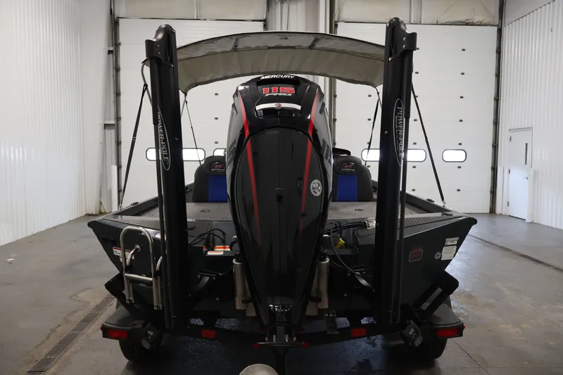Slide: The Image of 2023 Ranger RT188P boat with Mercury engine in a garage setting. - 6
