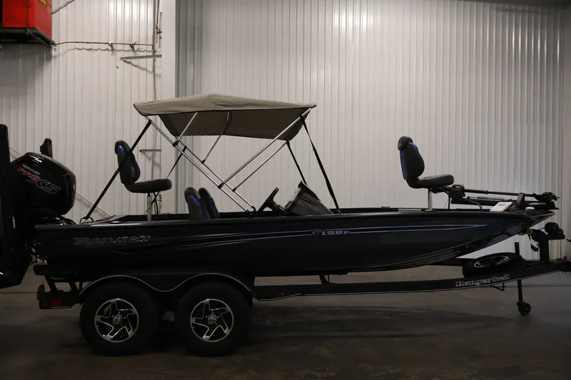 Slide: The Image of 2023 Ranger RT188P fishing boat with canopy in indoor setting. - 4