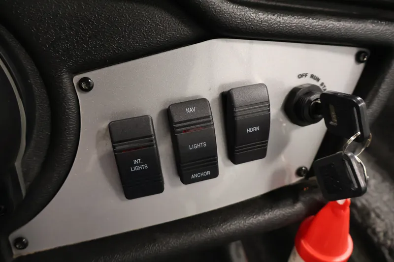 Slide: The Image of Control panel of 2023 Ranger RT188P boat with switches and ignition keys. - 32