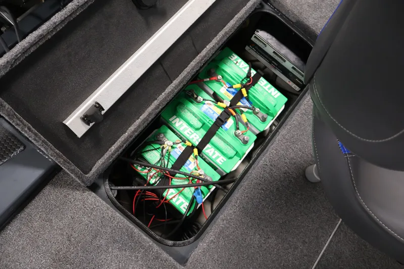 Slide: The Image of 2023 Ranger RT188P boat battery compartment with Interstate batteries and wiring. - 37