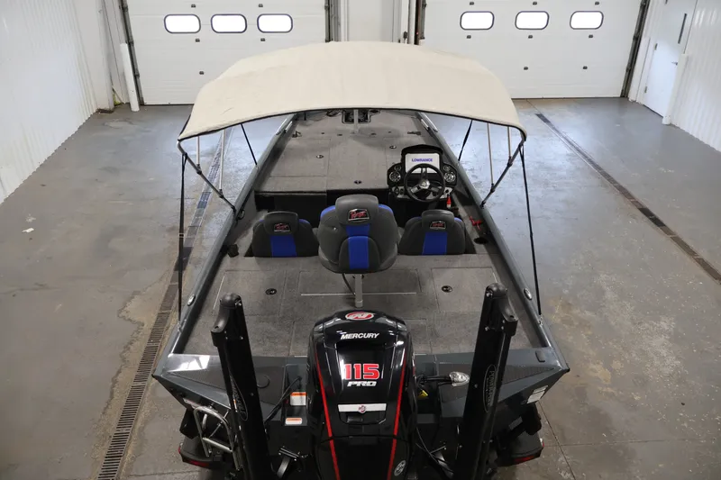 Slide: The Image of 2023 Ranger RT188P fishing boat with canopy and Mercury 115 Pro XS engine in garage. - 10