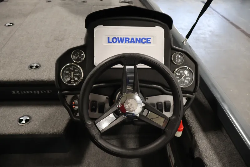 Slide: The Image of 2023 Ranger RT188P boat dashboard with Lowrance display and steering wheel. - 26