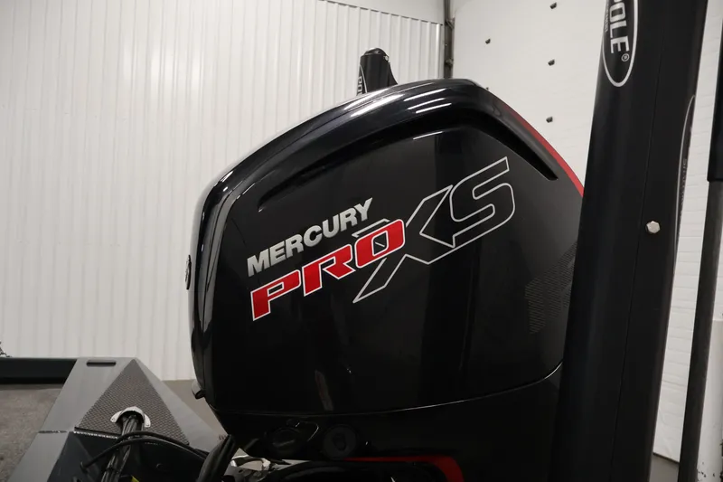 Slide: The Image of 2023 Ranger RT188P with Mercury Pro XS outboard motor in a garage setting. - 43