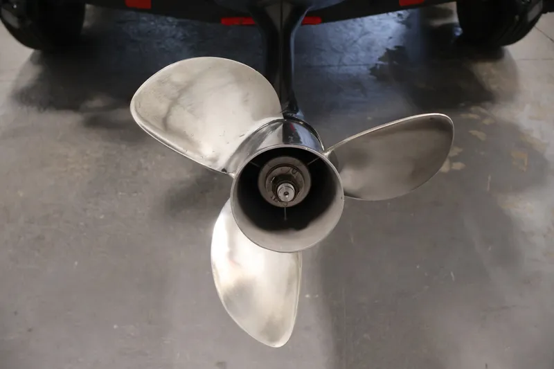 Slide: The Image of 2023 Ranger RT188P boat propeller on concrete floor, showcasing three polished blades. - 45