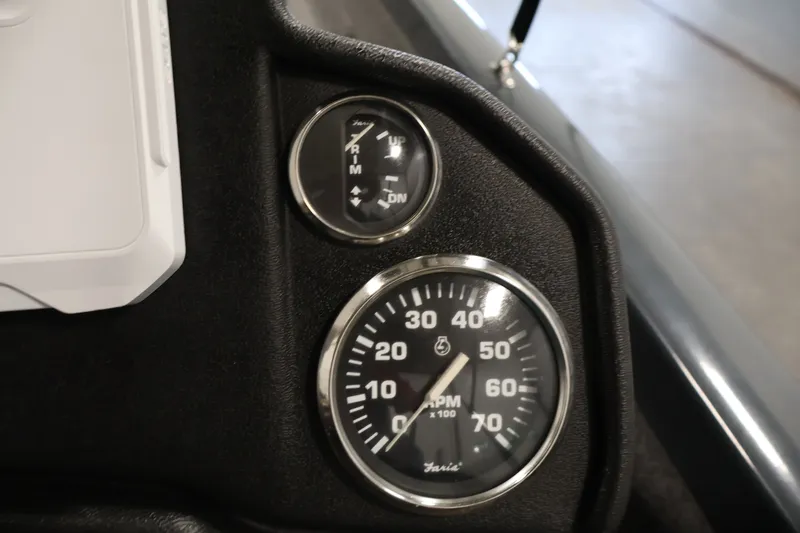 Slide: The Image of Dashboard gauges of 2023 Ranger RT188P boat, showing RPM and trim indicators. - 28