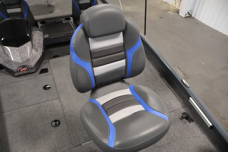 Slide: The Image of 2023 Ranger RT188P boat seat with gray and blue accents, on a carpeted deck. - 18