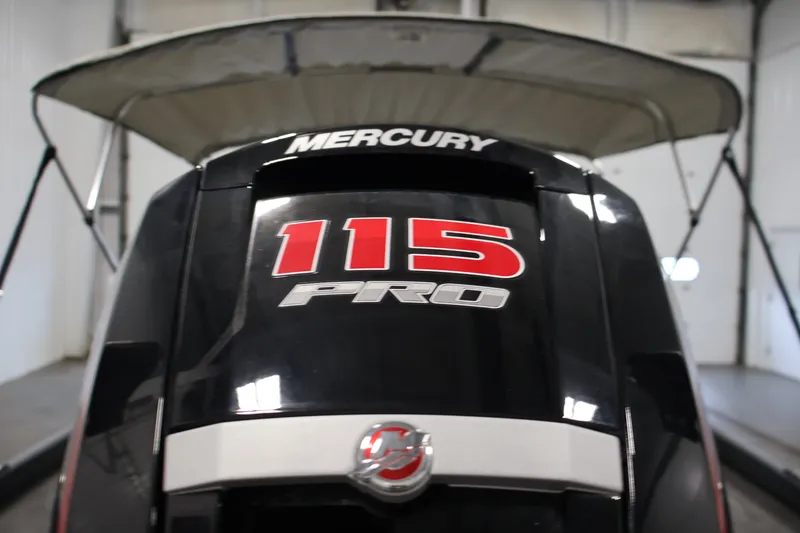 Slide: The Image of 2023 Ranger RT188P boat with Mercury 115 Pro outboard motor in a garage. - 44