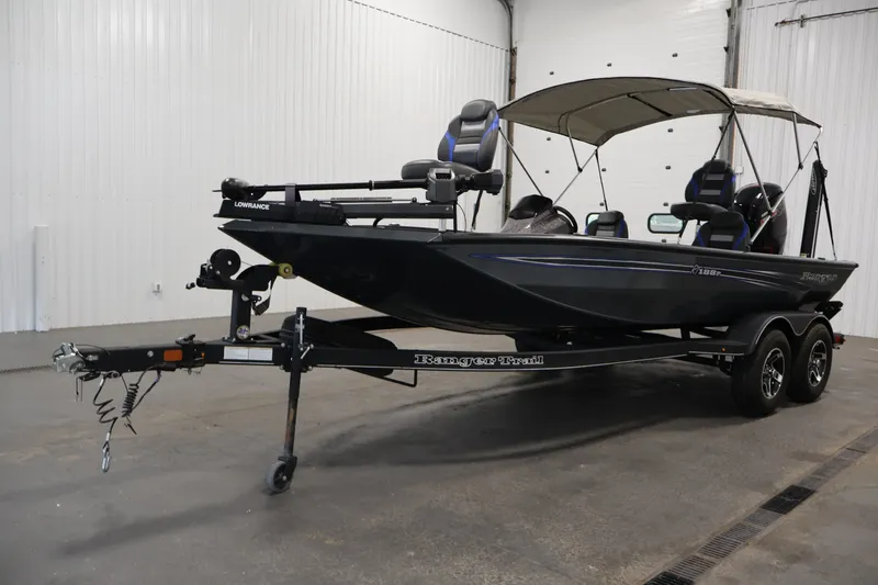 Slide: The Image of 2023 Ranger RT188P fishing boat on trailer in indoor setting. - 48