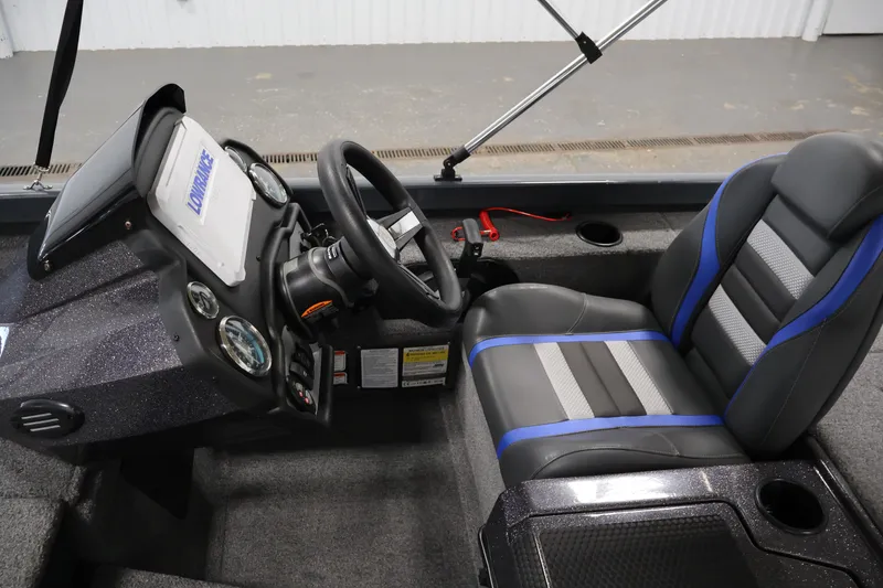 Slide: The Image of 2023 Ranger RT188P boat cockpit with steering wheel and modern dashboard. - 25