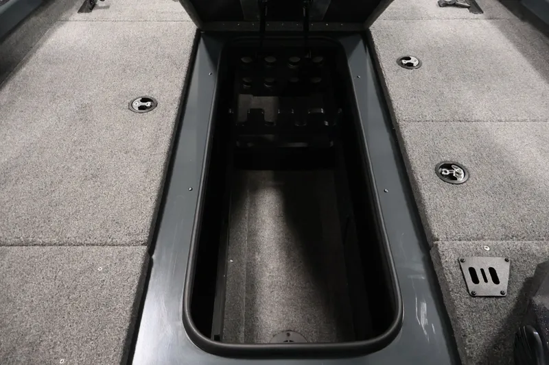 Slide: The Image of 2023 Ranger RT188P boat interior storage compartment with carpeted flooring and secure latches. - 22