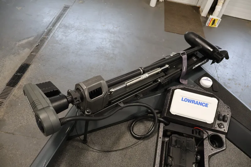 Slide: The Image of 2023 Ranger RT188P boat with Lowrance trolling motor and fishfinder in a garage setting. - 11