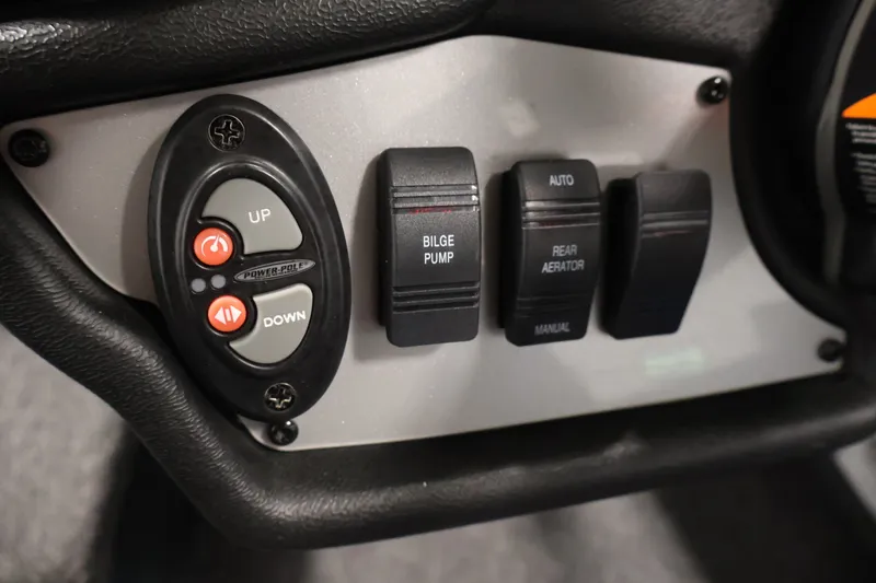 Slide: The Image of Control panel of 2023 Ranger RT188P boat with switches for bilge pump and aerator. - 31