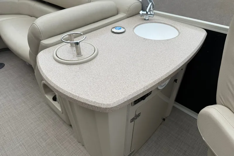 Slide: The Image of Interior of 2016 Premier 270 Intrigue RF boat with sink and cup holder. - 18