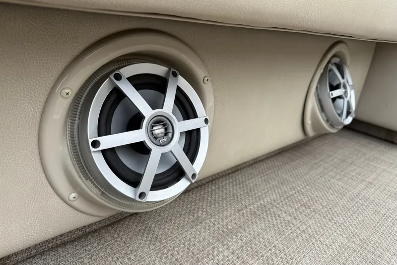 Slide: The Image of Speakers installed in a 2016 Premier 270 Intrigue RF boat, featuring beige upholstery. - 14