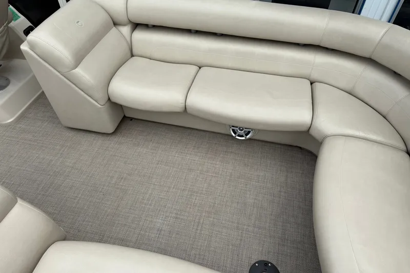 Slide: The Image of Luxurious beige seating on 2016 Premier 270 Intrigue RF boat, featuring plush upholstery. - 21