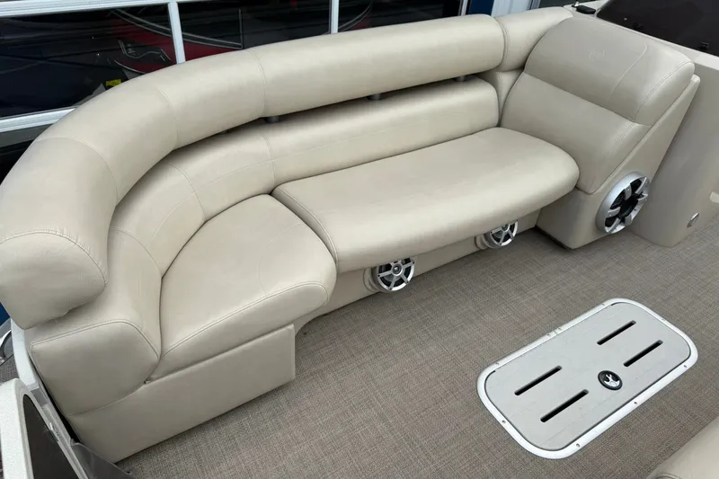 Slide: The Image of Luxurious seating on 2016 Premier 270 Intrigue RF boat with beige upholstery and built-in speakers. - 13