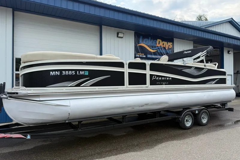 Slide: The Image of 2016 Premier 270 Intrigue RF pontoon boat on trailer outside Lake Days Marine. - 3