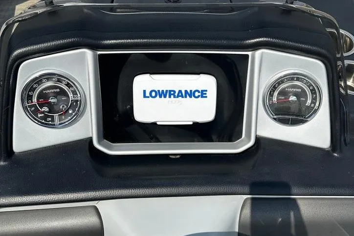 Slide: The Image of Dashboard of 2020 Harris Solstice 230 SL with Lowrance display and gauges. - 12