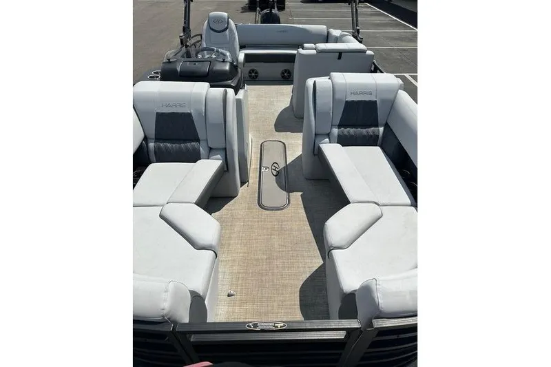 Slide: The Image of 2020 Harris Solstice 230 SL pontoon boat interior with plush seating and spacious layout. - 17