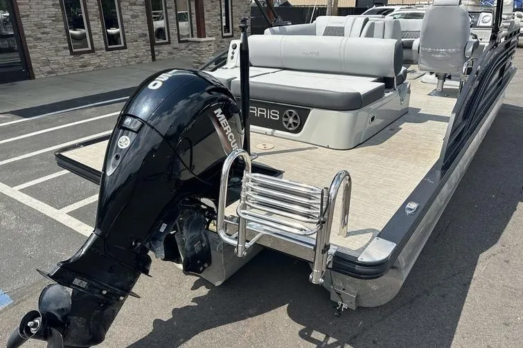 Slide: The Image of 2020 Harris Solstice 230 SL pontoon boat with Mercury outboard motor and swim ladder. - 14