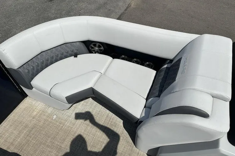 Slide: The Image of Luxurious seating on 2020 Harris Solstice 230 SL boat, featuring elegant white upholstery. - 15