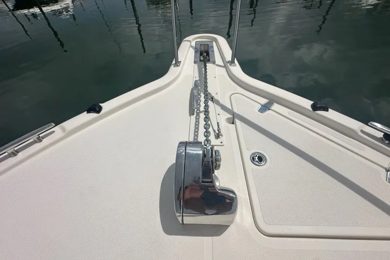 Slide: The Image of Bow of 2013 Pursuit OS 345 Offshore boat with anchor chain and winch. - 35