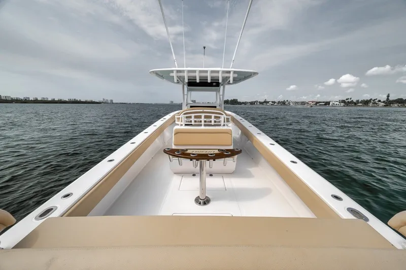 Slide: The Image of 2020 Bahama 41 boat on open water, showcasing spacious deck and seating. - 40