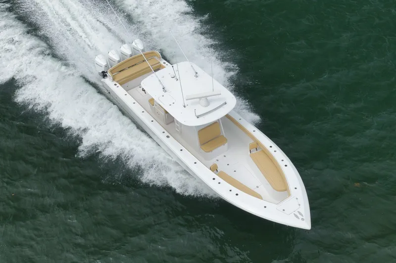 Slide: The Image of 2020 Bahama 41 boat cruising on water with powerful engines. - 42