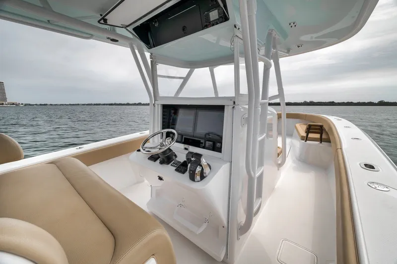 Slide: The Image of Center console of a 2020 Bahama 41 boat with modern navigation equipment. - 26