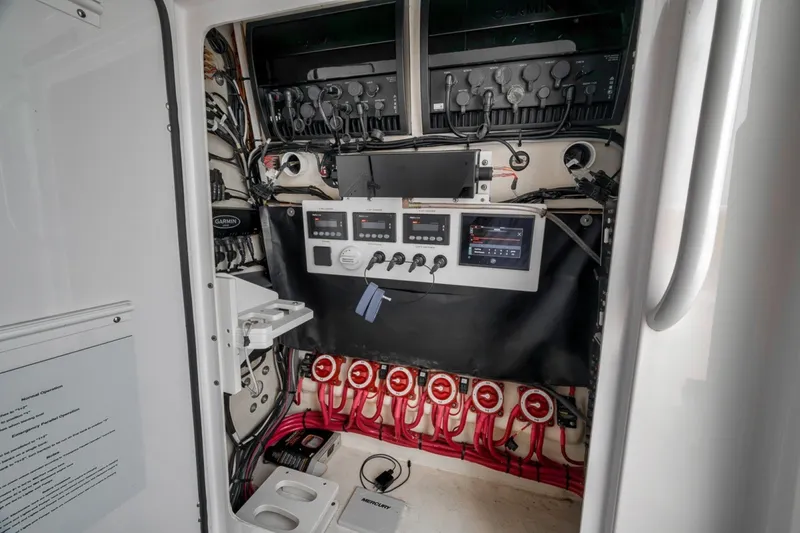 Slide: The Image of Electrical control panel inside a 2020 Bahama 41 boat, featuring advanced navigation systems. - 33