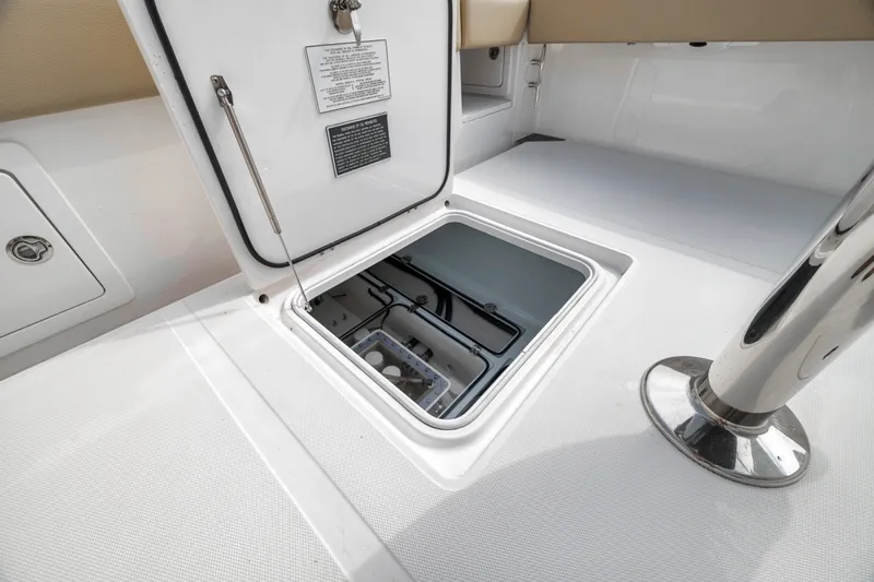 Slide: The Image of Open hatch on 2020 Bahama 41 boat deck, revealing storage compartment. - 38