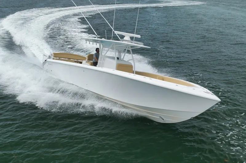 Slide: The Image of 2020 Bahama 41 boat cruising swiftly on open water. - 44