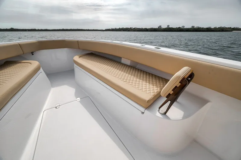 Slide: The Image of Luxurious seating on 2020 Bahama 41 boat, featuring tan cushions and sleek design. - 19