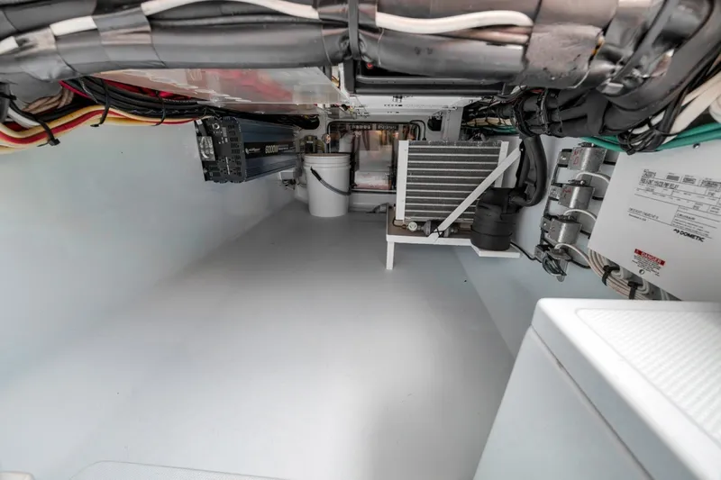 Slide: The Image of Engine room of a 2020 Bahama 41 boat, showcasing wiring and equipment. - 34