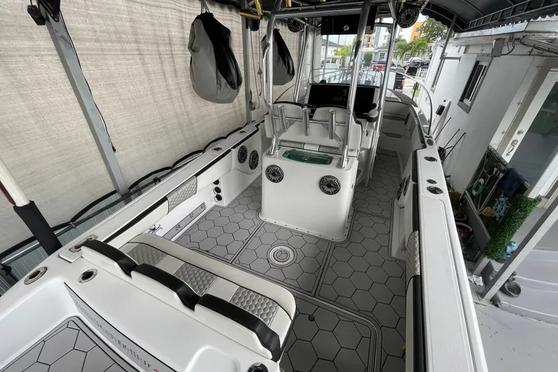 Slide: The Image of 1998 Donzi 29 ZF Cuddy boat interior with modern seating and hexagonal flooring. - 53