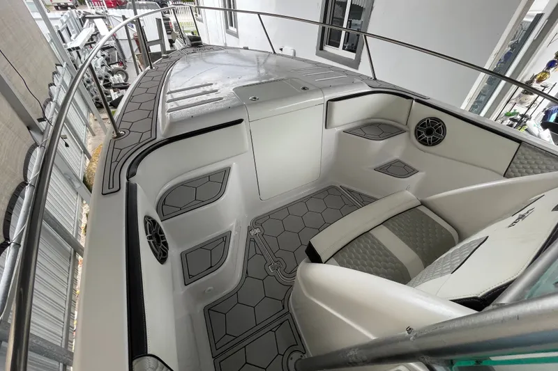 Slide: The Image of 1998 Donzi 29 ZF Cuddy boat interior with modern seating and hexagonal flooring design. - 25