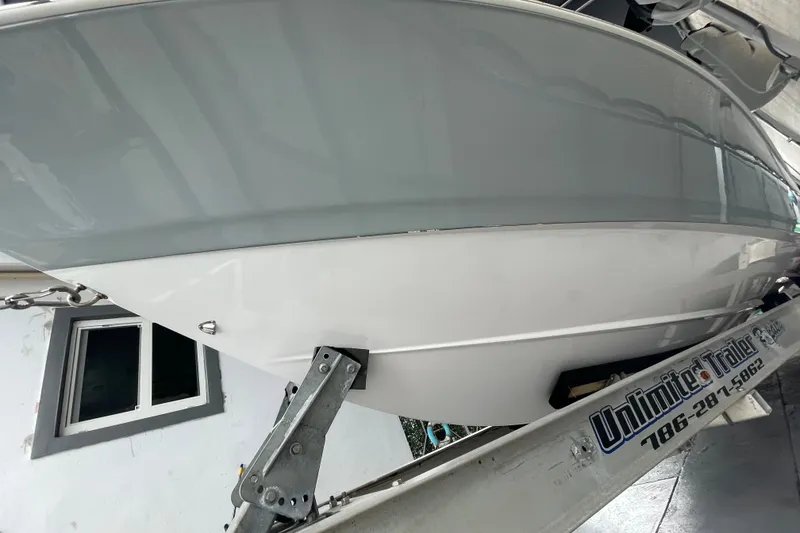 Slide: The Image of 1998 Donzi 29 ZF Cuddy boat on trailer, side view in storage facility. - 16