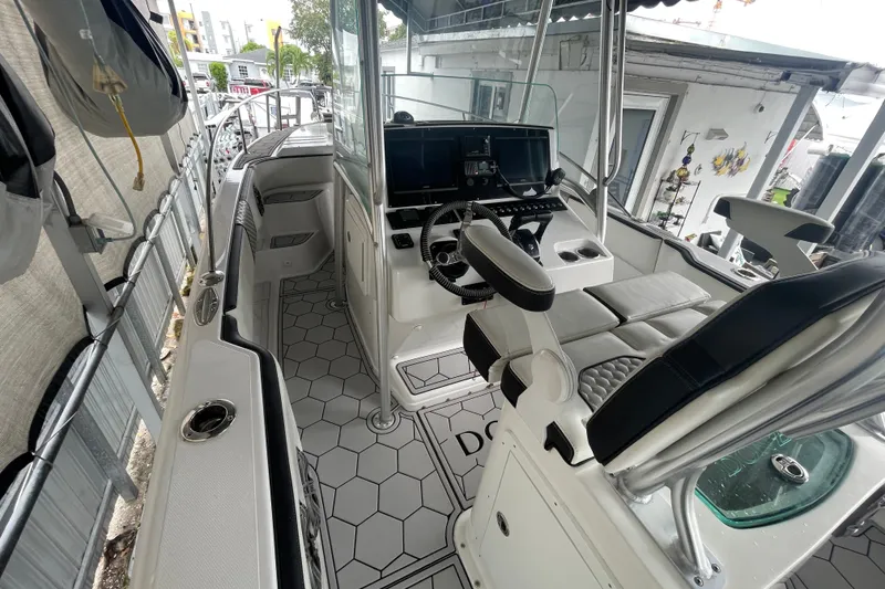 Slide: The Image of 1998 Donzi 29 ZF Cuddy boat interior with modern helm and seating. - 36