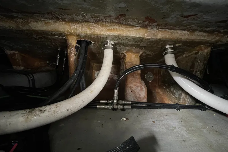 Slide: The Image of Interior view of 1998 Donzi 29 ZF Cuddy boat showing plumbing and wiring. - 50
