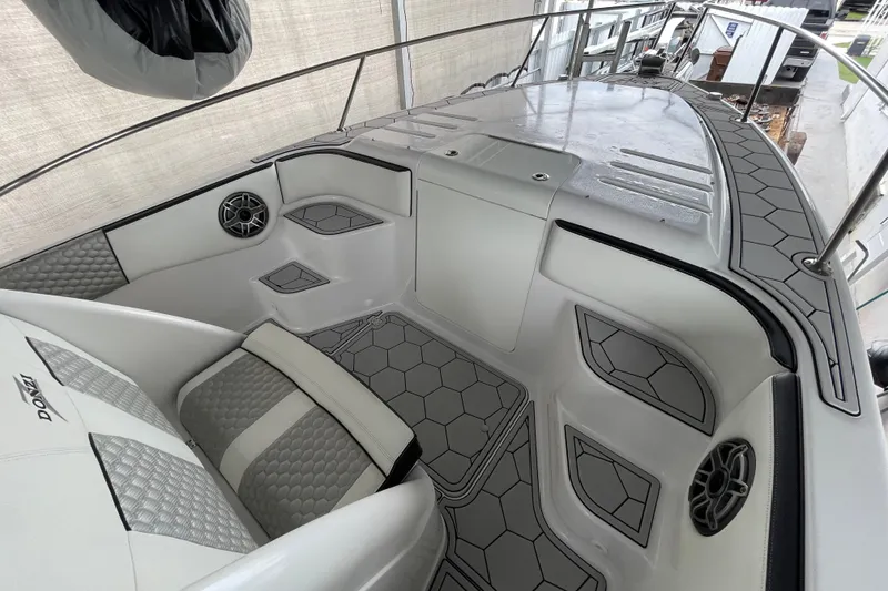 Slide: The Image of 1998 Donzi 29 ZF Cuddy boat interior with modern seating and hexagonal design accents. - 24