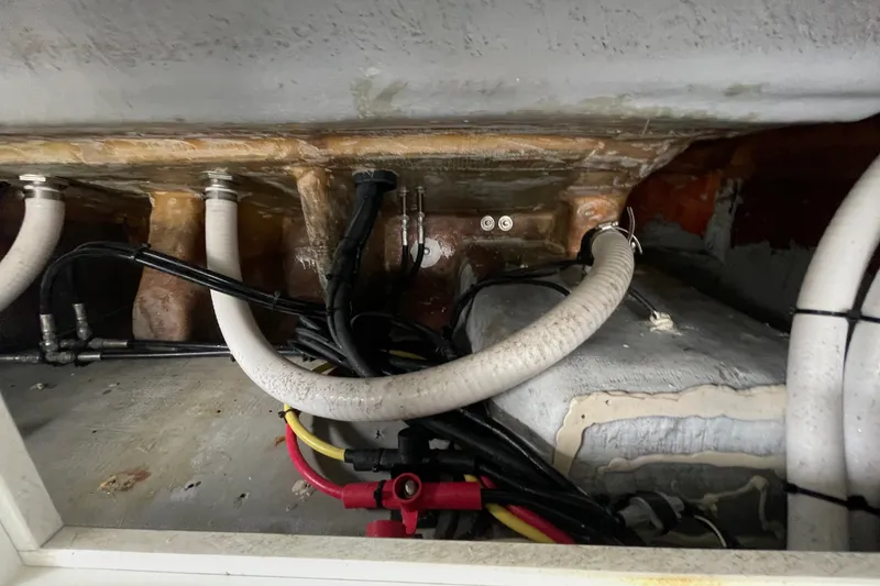 Slide: The Image of 1998 Donzi 29 ZF Cuddy boat interior wiring and plumbing details. - 49