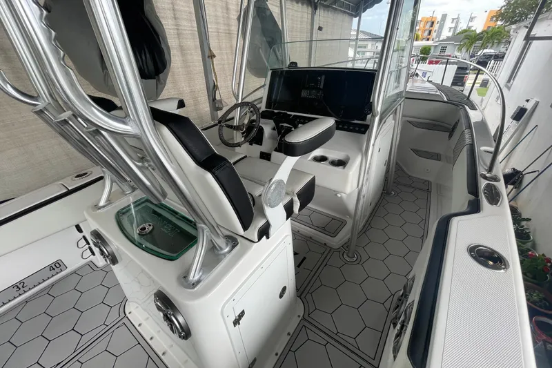 Slide: The Image of 1998 Donzi 29 ZF Cuddy boat interior with modern helm and seating. - 37