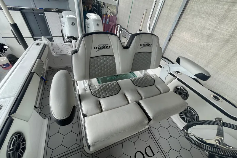 Slide: The Image of 1998 Donzi 29 ZF Cuddy boat interior with dual seats and modern design. - 39