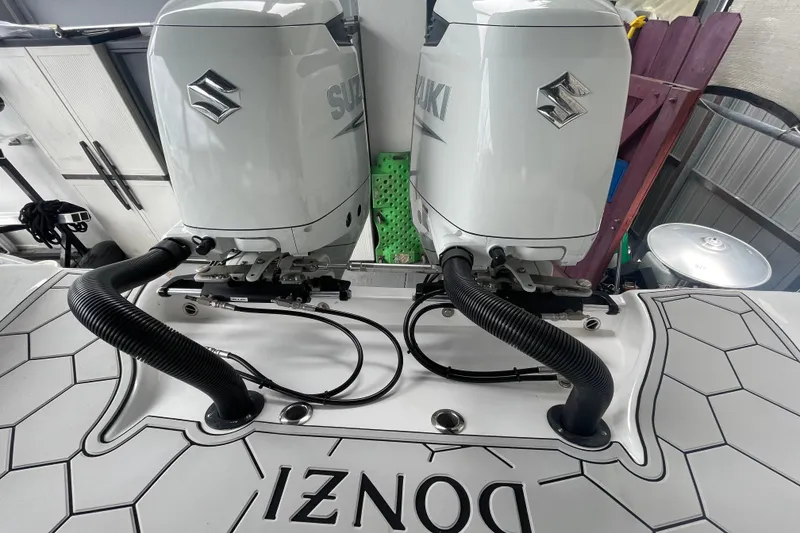 Slide: The Image of Twin Suzuki outboard engines on a 1998 Donzi 29 ZF Cuddy boat. - 30